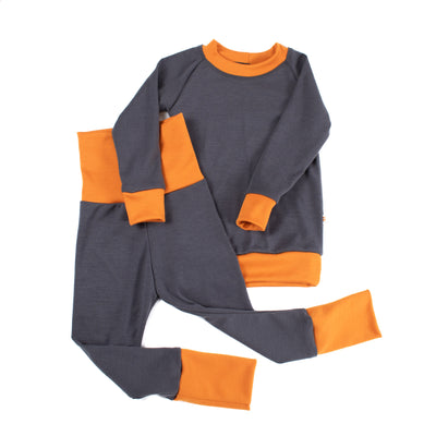 Kids' adventure-ready grey and orange base layer set from TK Clothing Inc, handmade in Canada.