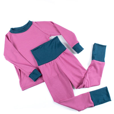 Pink and teal handmade kids base layer set from TK Clothing Inc on white background