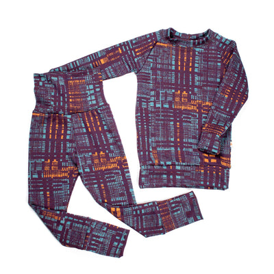 Adventure-ready kids’ base layer set with purple, blue, and orange geometric print from TK Clothing